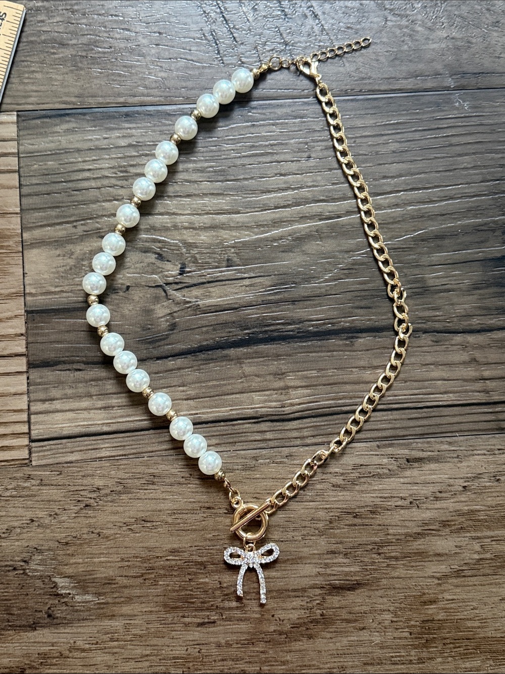 Gold Pearl Necklace with Crystal Bow Pendant